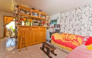 a living room with a couch and a table at Chez Pilar in Avatoru