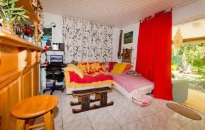 a living room with a couch and a table at Chez Pilar in Avatoru