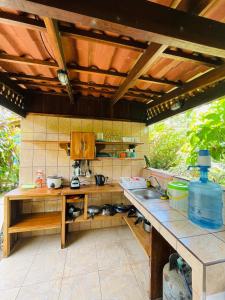 a kitchen with a sink and a counter top at Cabinas Yamann in Manzanillo