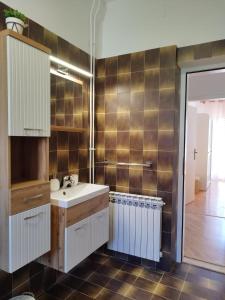 a bathroom with a sink and a shower at Tudija apartment3-West side place, 90m2, big terrace, beautiful beach front view in Trogir +58 photos