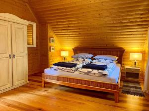 Posteľ alebo postele v izbe v ubytovaní holiday home, Slajszewo