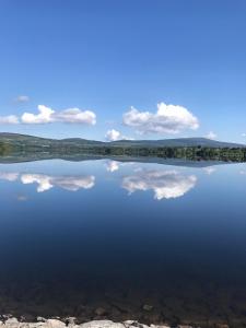 a large body of water with clouds in the sky at Scarr View 1st floor Apartment A98W710 in Wicklow