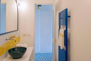 a bathroom with a bowl sink and a shower at o' mar - Amalfi Coast Suite in Praiano