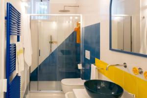 a bathroom with a sink and a toilet and a shower at o' mar - Amalfi Coast Suite in Praiano