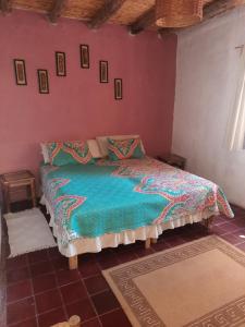 a bedroom with a bed in a room at Posta Kamak Eco Posada Rural in Bella Vista