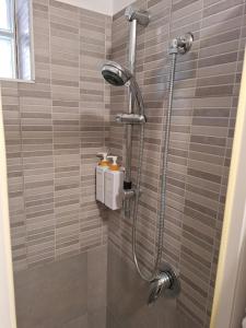 a shower stall in a bathroom with a shower at La casa di Charlie in San Giovanni Teatino