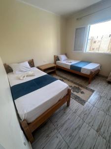 מיטה או מיטות בחדר ב-bianco Hotel & Suites