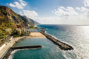 an aerial view of a beach next to the ocean at Villa Holiday Sun by Holiday Rental Madeira in Ponta do Sol