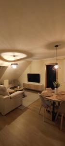 a living room with a couch and a table at Terraza Vistas 360° in Burela de Cabo