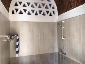 a bathroom with a shower and a ceiling at Garden view guest house in Luxor +109 photos