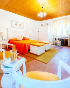 a bedroom with a bed and a table and chairs at B&B La Terazza Sul Cielo di Maratea in Maratea