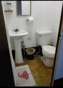 a bathroom with a toilet and a sink at Hotel CASA EL Calvario in Antigua Guatemala +13 photos