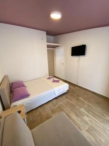 Postel nebo postele na pokoji v ubytování Apartmani Resetar