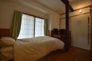 Postel nebo postele na pokoji v ubytování Guest House Ilonggo