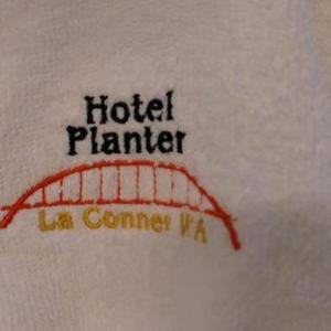 a tattoo of a hotel planter on a persons arm at Hotel Planter in La Conner