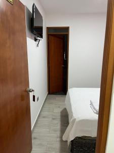 Postel nebo postele na pokoji v ubytování Hospedaje Limatambo