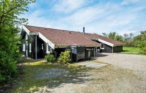 a house with a red roof and a yard at Nice Home In Sydals With Wifi in Høruphav