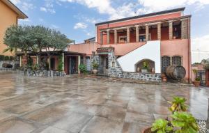 an empty courtyard in front of a building at Fiori in Santa Venerina +13 photos
