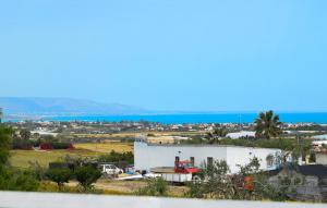 a view of the ocean from a house at Beautiful Home In Noto With Wifi in Noto