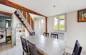 a kitchen and dining room with a table and chairs at 2 Bedroom Lovely Home In Bourville in Sainte-Colombe