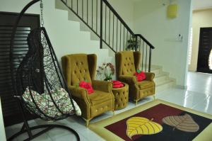 ルムットにあるUwais Homestay Segari Lumutのギャラリーの写真 +1枚の写真