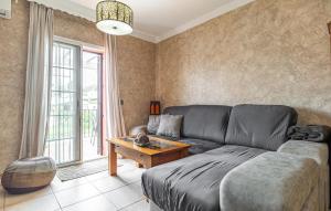 a living room with a couch and a table at Beautiful Apartment In Nerja With Wifi in Nerja