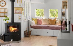 a living room with a couch and a fireplace at Gorgeous Home In Glesborg With Wifi in Glesborg