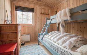 a bedroom with a bunk bed in a wooden room at 5 Bedroom Gorgeous Home In Engerdal in Nymoen +9 photos