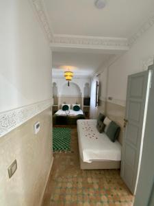 Postel nebo postele na pokoji v ubytování Riad Magnolia&SPA