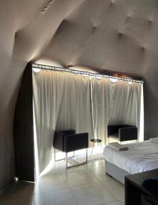 Ένα ή περισσότερα κρεβάτια σε δωμάτιο στο Rum parens