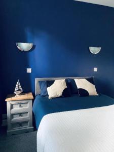 Posteľ alebo postele v izbe v ubytovaní Blue Bell