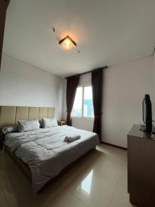 Postel nebo postele na pokoji v ubytování Comfy & Modern 1BR At Central
