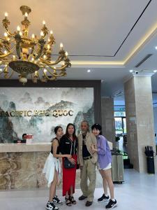 a group of people standing in a lobby at Pacific Apartment & Hotel Phu Quoc in Phu Quoc