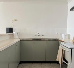 a kitchen with a sink and a counter top at Makai ‘Toward the Sea’ in Port Lincoln