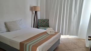 Letto o letti in una camera di Casa Iola