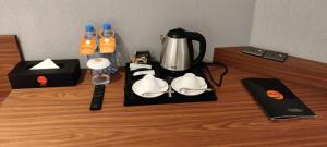 Příslušenství pro přípravu čaje a kávy v ubytování Hotel Omni Residency Baridhara