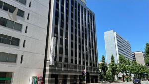a tall building on the side of a street at Hotel Hokke Club Fukuoka in Fukuoka
