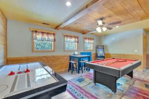 a living room with a ping pong table in it at Back Stroke chalet in Gatlinburg