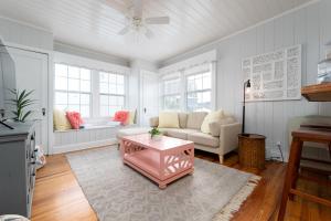 a living room with a couch and a table at Be A Nomad - Beach Bliss - Close to beach in Jacksonville Beach
