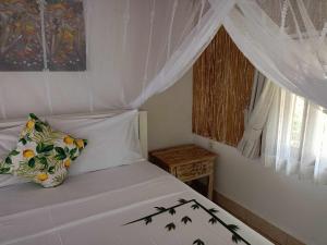 Bintang Tiga Bungalows Gili Air客房内的一张或多张床位