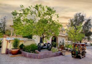 a house with a toy car in front of it at Chokhi Dhani The Ethnic 5-Star Deluxe Resort in Jaipur