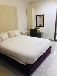 Säng eller sängar i ett rum på Agentour Guesthouses