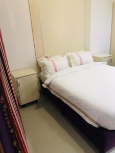 Giường trong phòng chung tại Agentour Guesthouses