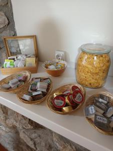 a shelf with bowls of food and a jar of food at Pensión liebana in San Vicente de la Barquera