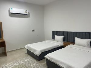 Posteľ alebo postele v izbe v ubytovaní Haima Hotel