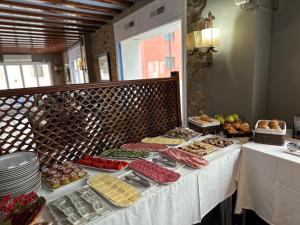 a buffet table with many different types of food at New Roser in L'Escala