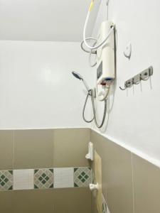 a bathroom with a hair dryer on the wall at La Oviedo Villas Resort Boracay in Boracay