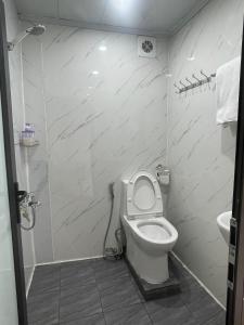 a bathroom with a toilet and a sink at Sunny Garden Balcony in Old Quarter, Free Laundry, Free Water in Hanoi