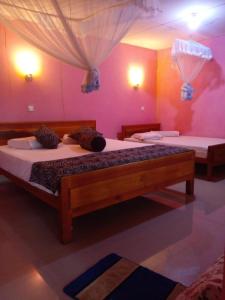 Postel nebo postele na pokoji v ubytování Omi Relax Inn + 3 fotografie