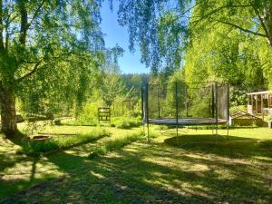 a trampoline in the middle of a yard at Lidhem herrgård. Bed & Breakfast och mindre lägenheter in Vimmerby
